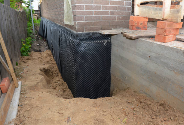 SJ Waterproofing Pros technician performing targeted Emergency Waterproofing assessment in Baldwinsville, NY